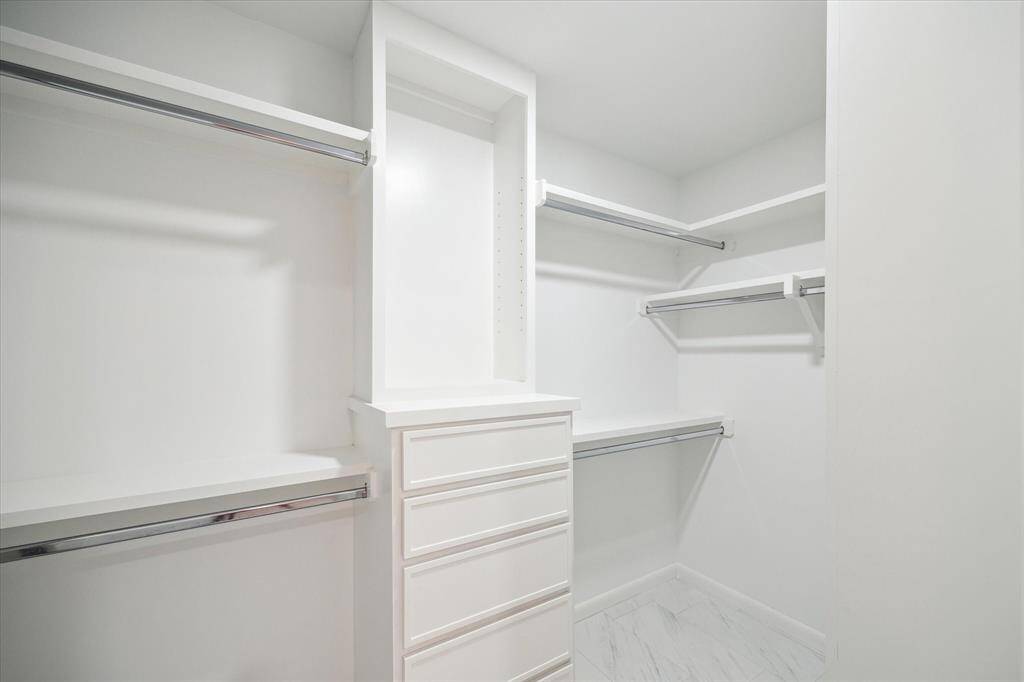 Spacious walk-in closet with ample storage and organization.