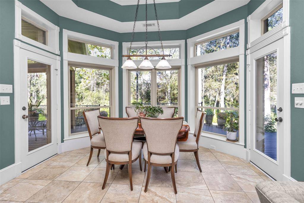 Bright breakfast area with bay window overlooking the back yard