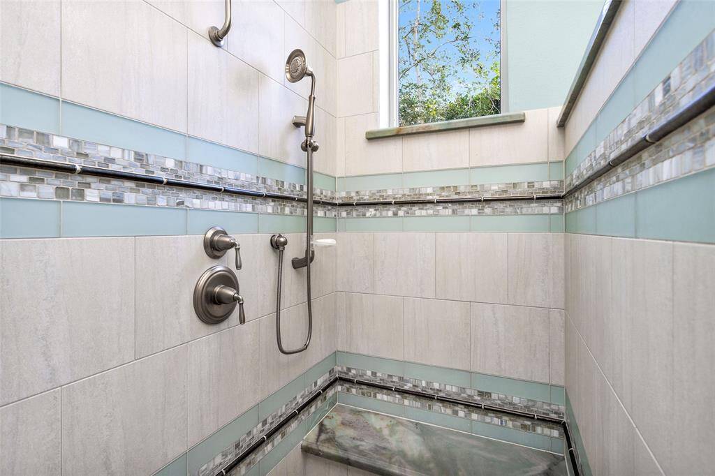 Primary shower with custom tiled finish