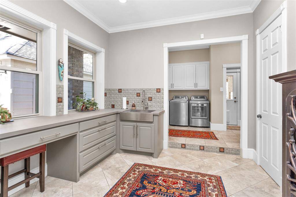 2 tier  area with laundry room and craft room with built-ins