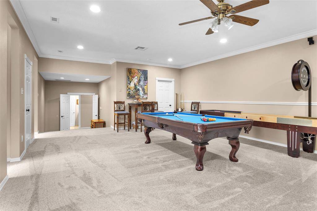 4 doors lead to additional storage rooms & attic storage areas