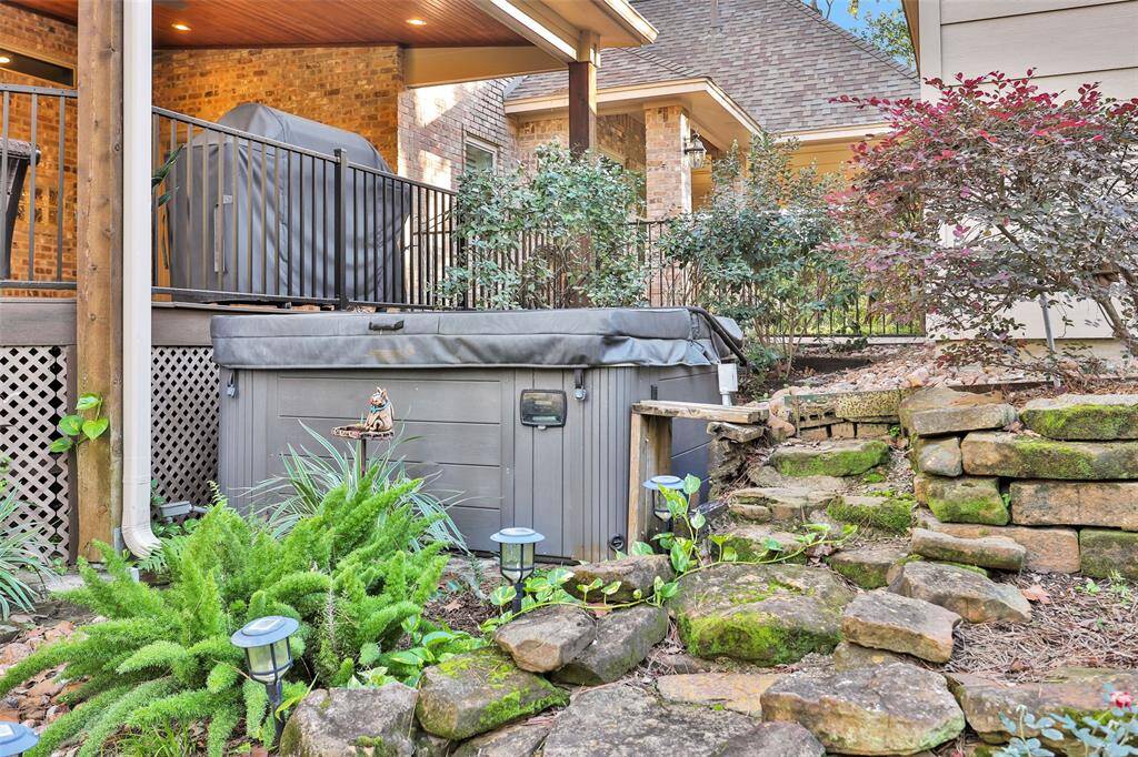 Hot tub with UV sanitizer system off the back patio is included