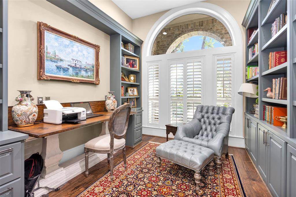 Home office features built-ins with custom desk that can slide out as an extension table in the dining room