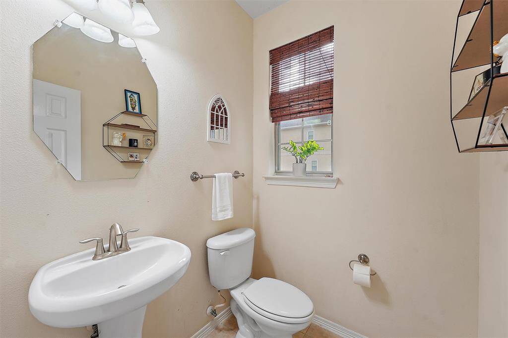 This cozy powder room / half bath is conveniently located on the second level.