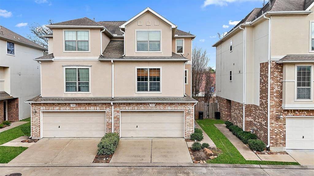 This townhome located on the right boasts large windows perfect for letting in lots of natural light. It also has a 2 car attached garage for private entry.