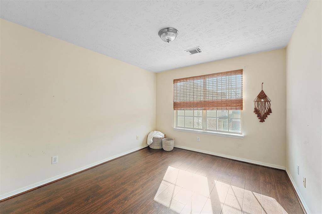 Secondary bedroom is also located on the third floor. It's located around the corner from the primary offering privacy and a large closet.