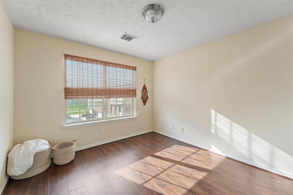 Secondary bedroom also has a large window that brings in lots of natural light.
