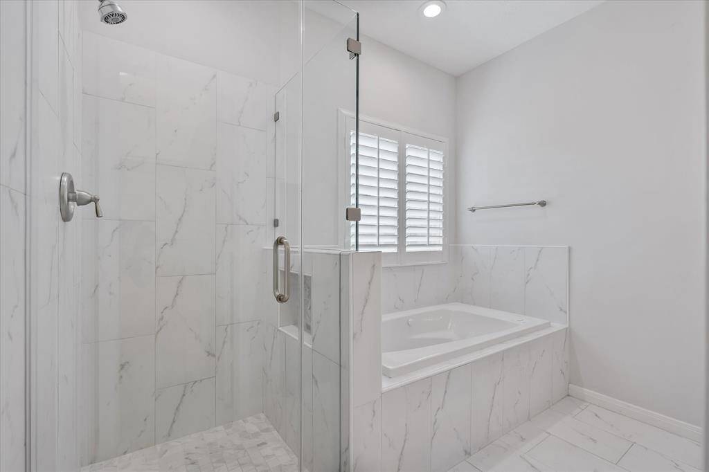 Spacious walk-in shower and soaking tub