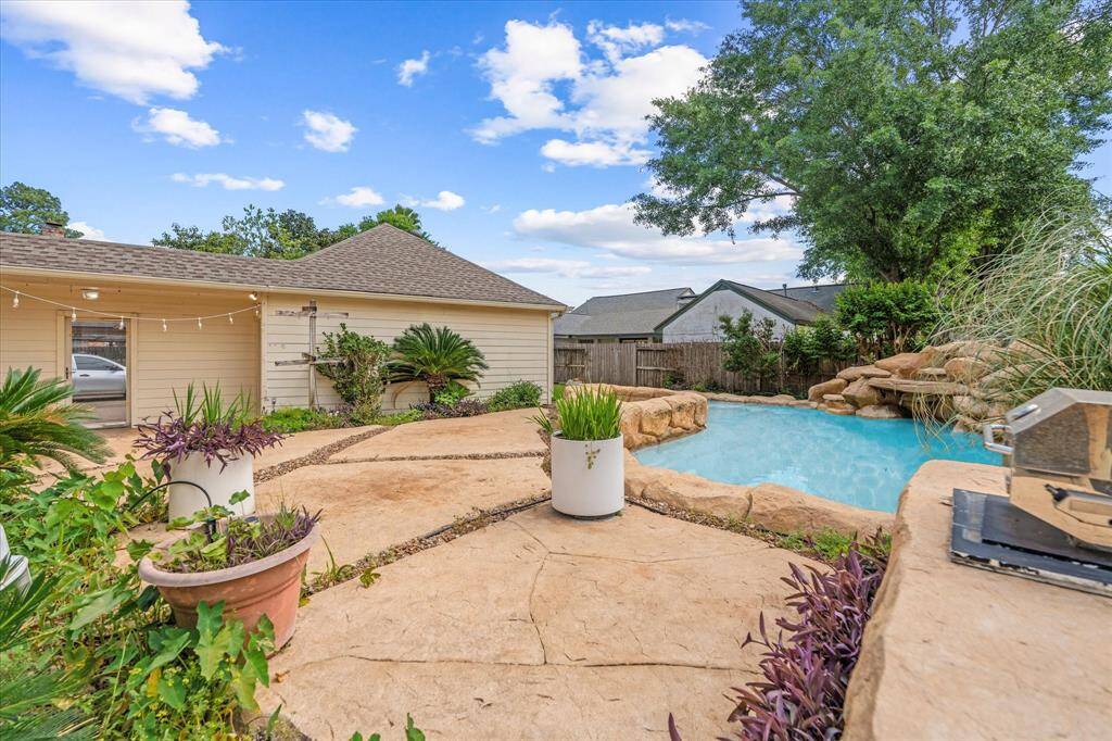 Lush landscaping around the pool and backyard
