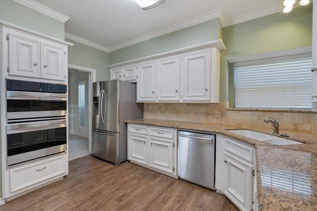 Chef's dream kitchen with stainless appliances, granite counters and easy car flooring.