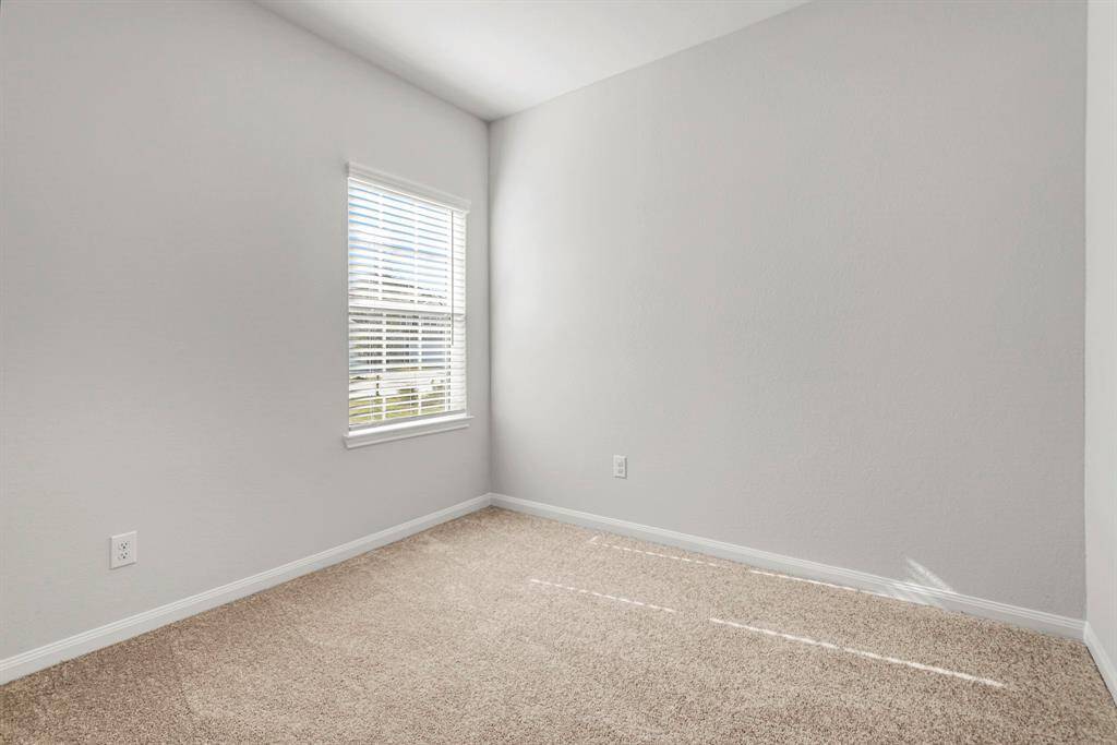The secondary bedroom is cozy and spacious.