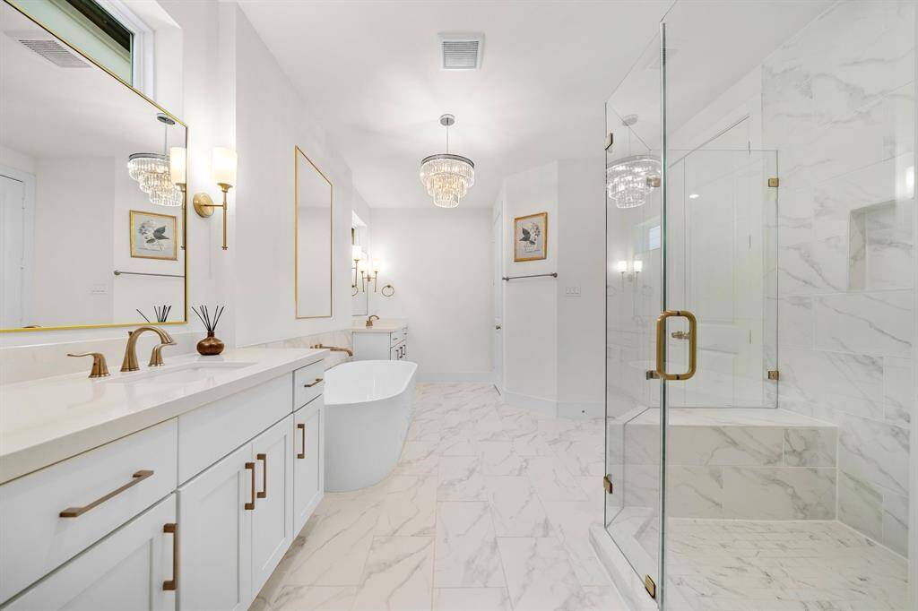 Indulge in luxury in this stunning master's bed bathroom.