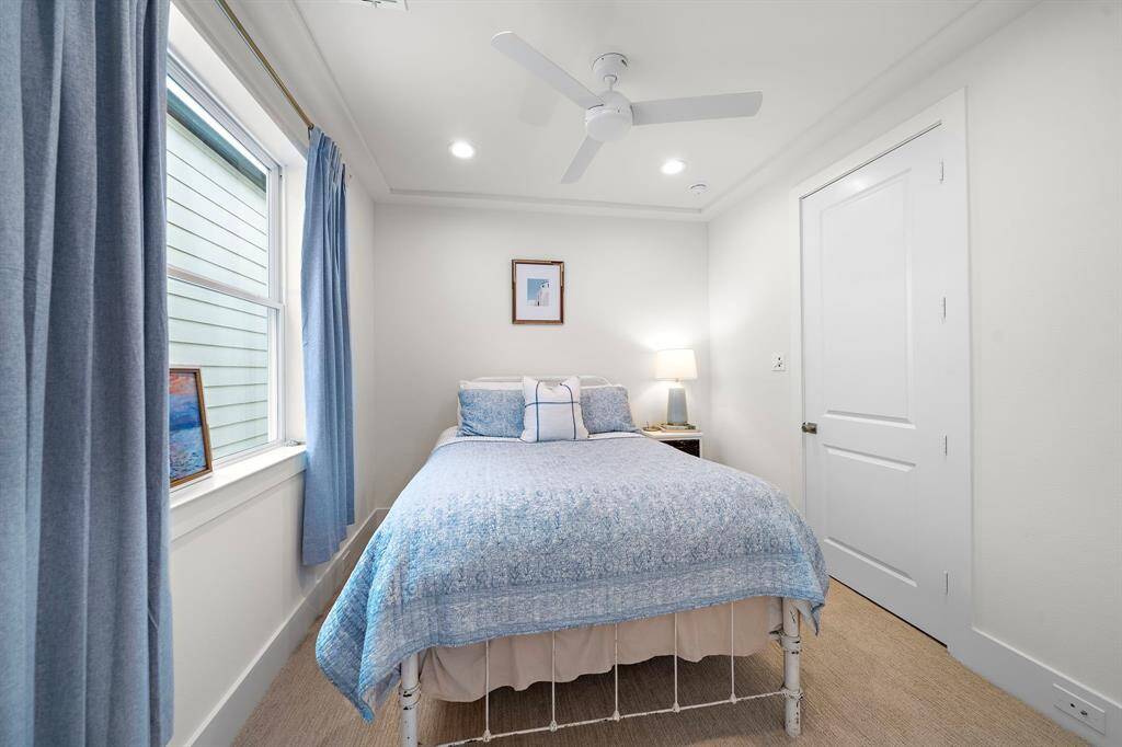 Stylish and serene secondary bedroom.