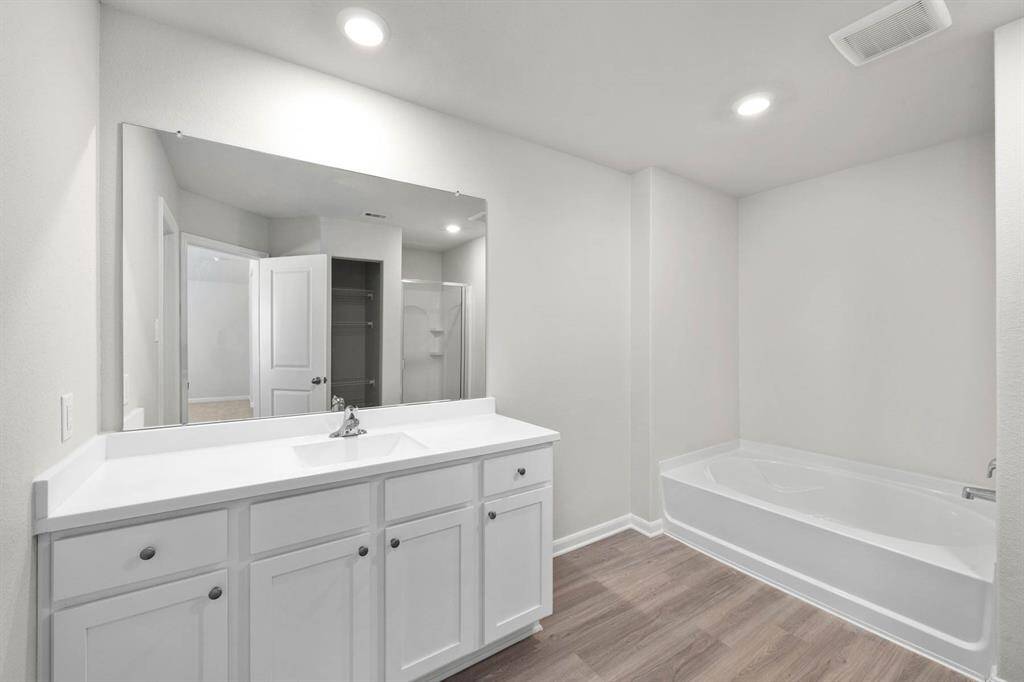 The luxurious soaking tub in the primary bathroom.