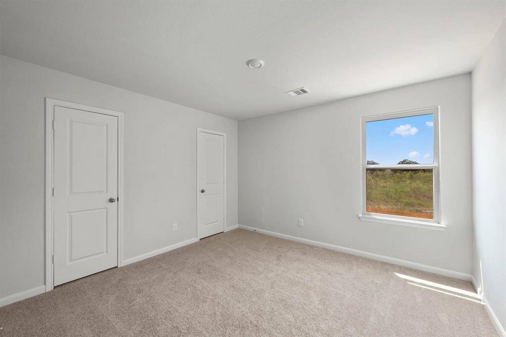 The secondary bedroom in the home.