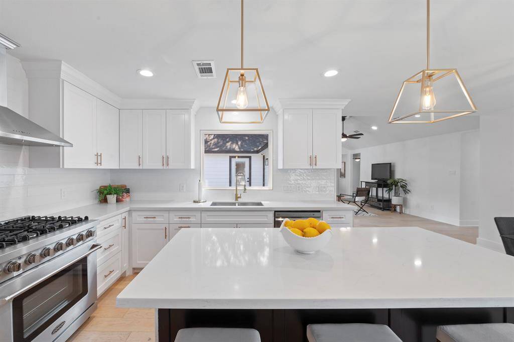 Whip up dinner with a view! The deep sink, window, and open layout keep everything light, bright, and connected.