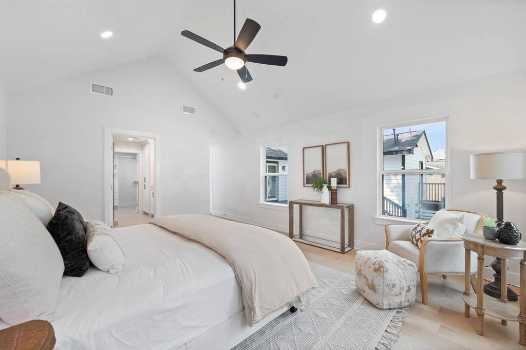 This dreamy primary retreat features vaulted ceilings, natural light, and direct access to a spa-inspired ensuite and private deck.