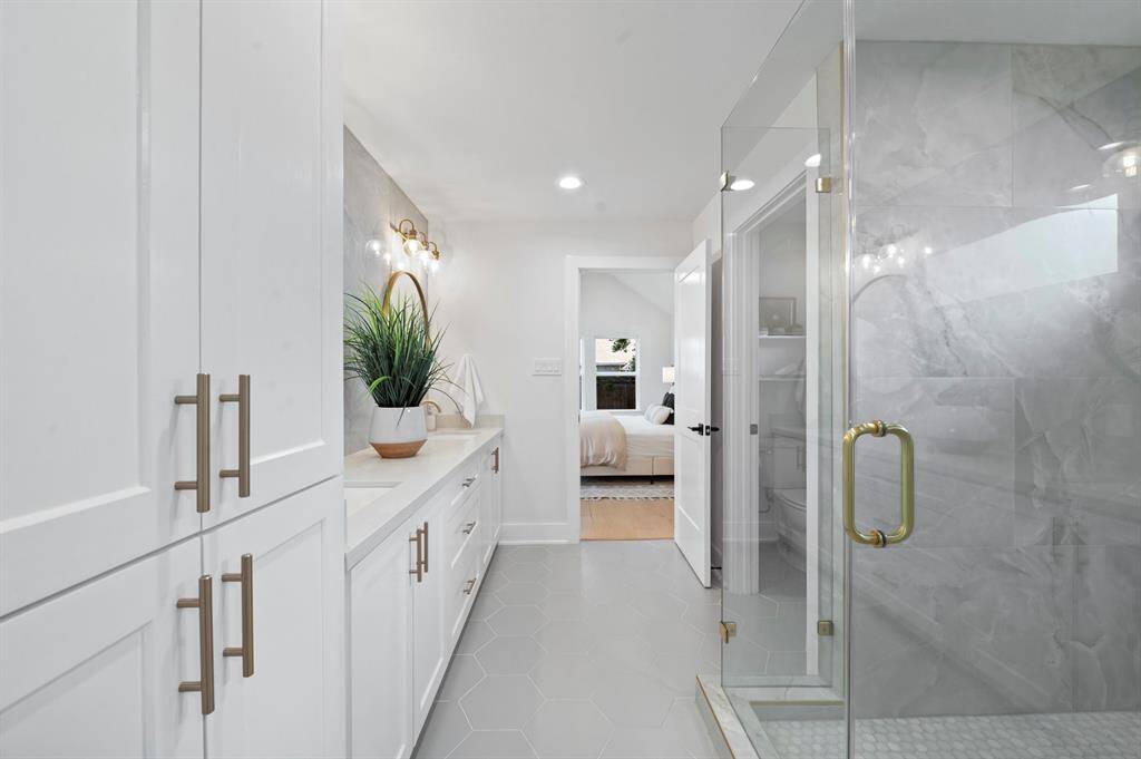 From shower to sleep, this layout flows effortlessly—built-in cabinetry, elegant finishes, and peaceful vibes throughout.