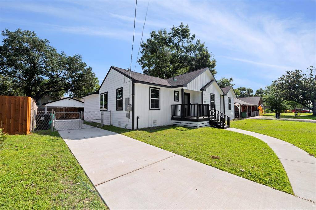 Enjoy private off-street parking with a gated driveway leading to a detached garage—plus plenty of room to play or entertain out front!