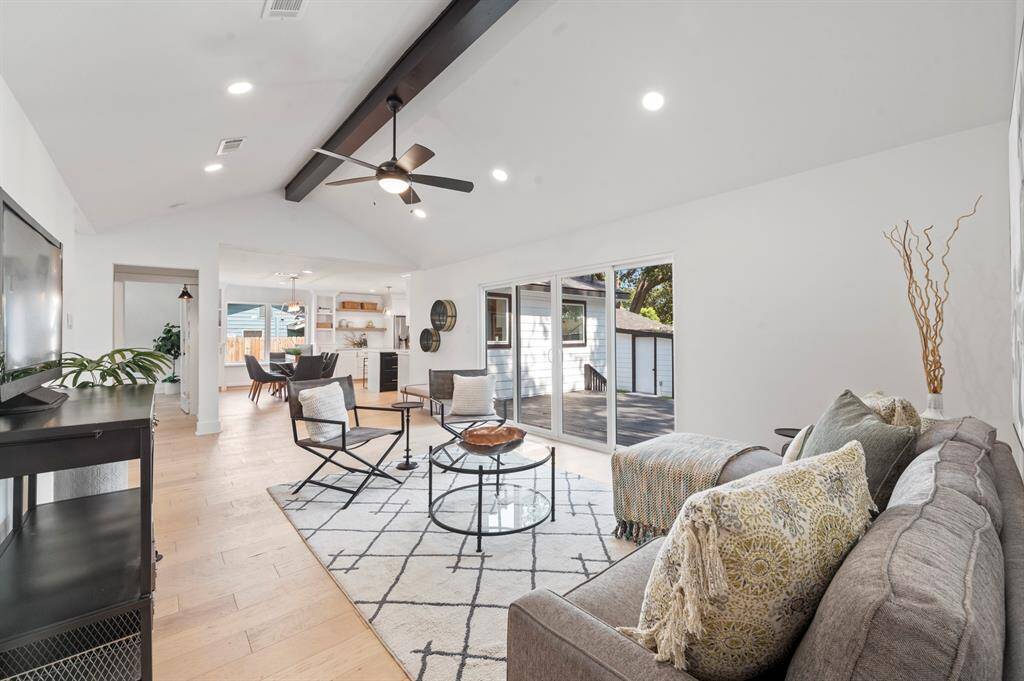Wide open sightlines connect the living room to the kitchen and dining, making it easy to host and gather with loved ones.