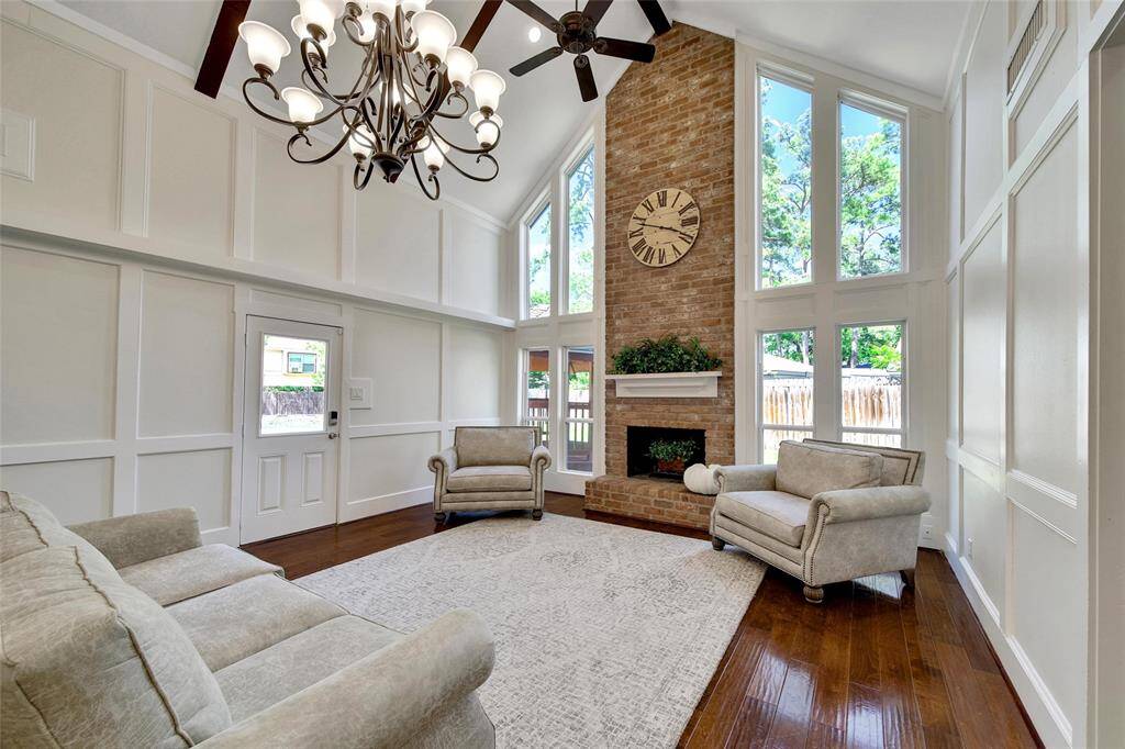 Vaulted ceilings frame a stunning fireplace view.