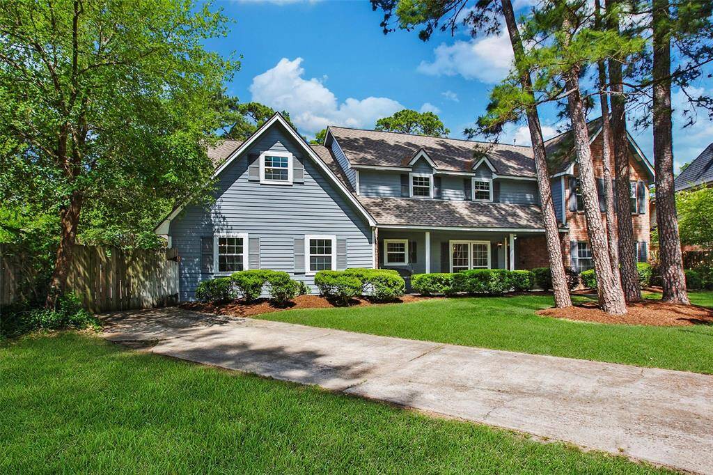 Mature trees and a spacious driveway welcomes you.