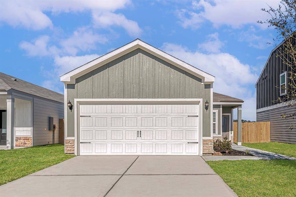 This one-story home features an exterior design that is both charming and durable.