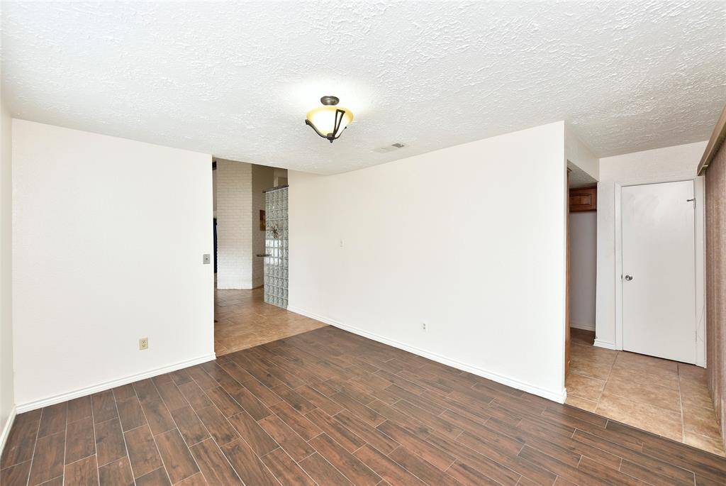 The dining room is conveniently accessed directly from the kitchen, as well as front the entry hall. The separate pantry, seen to the right, has lots of adjustable shelving.