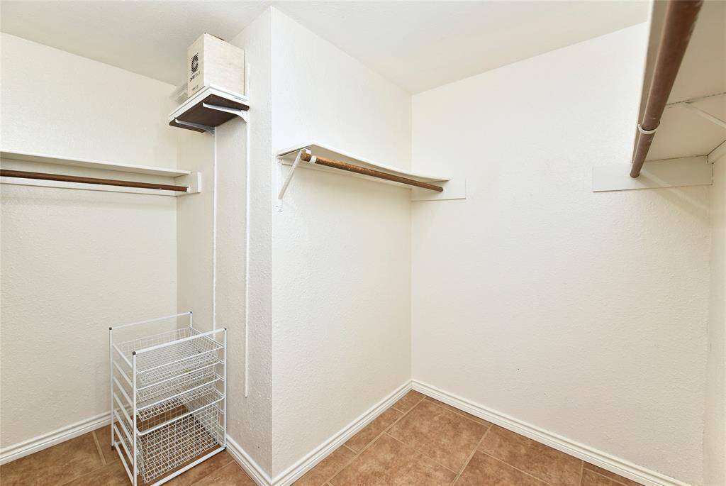 Another view of the primary walk-in closet - it's spacious enough for a dresser, too!
