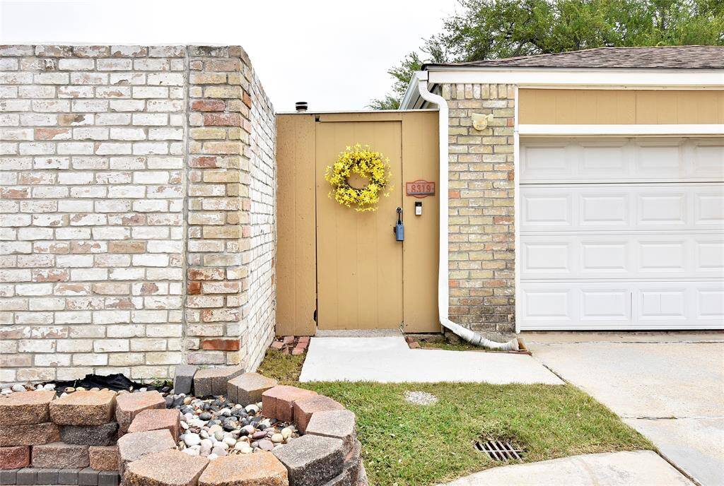 Two ways to enter - through the gate or through the double garage door.