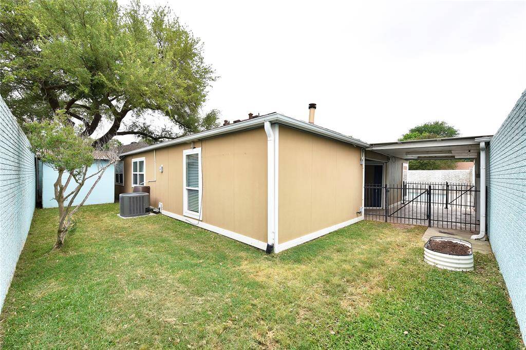 The backyard has a storage shed, painted to match the light blue brick wall.  The AC was replaced, inside and out, in 2018.