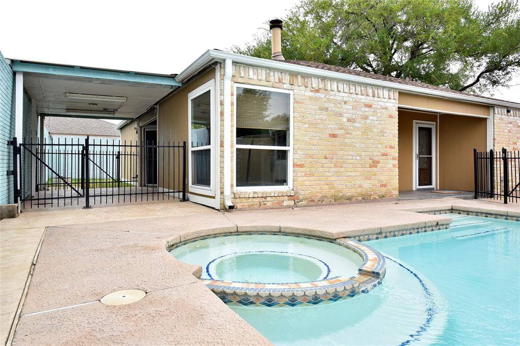 A large, covered patio on the side of the home is the perfect spot to relax away from the hot summer sun!