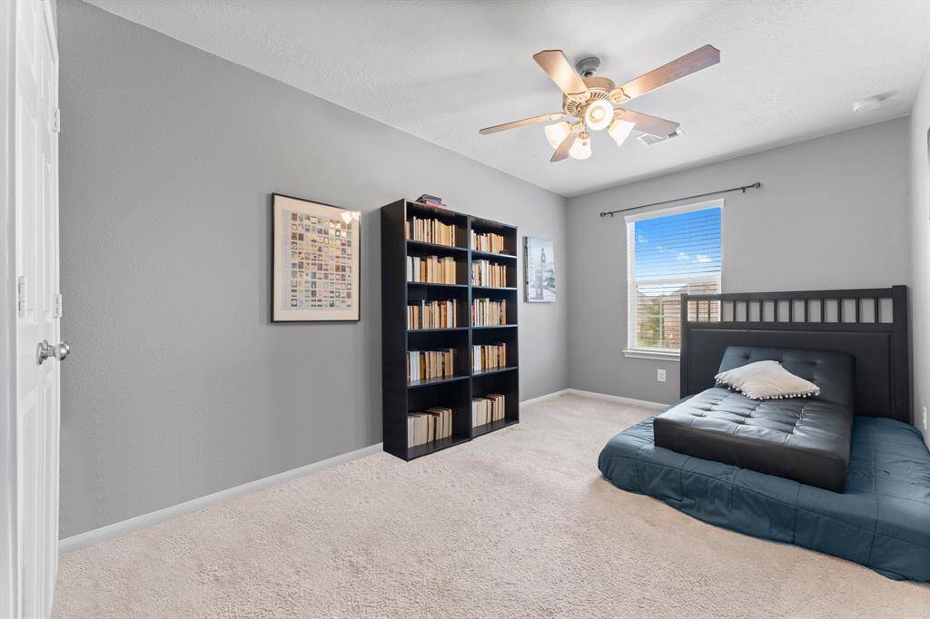 Bedroom #2 upstairs is approximately 13' x 9', and has a ceiling fan, blinds on the windows, and carpet.