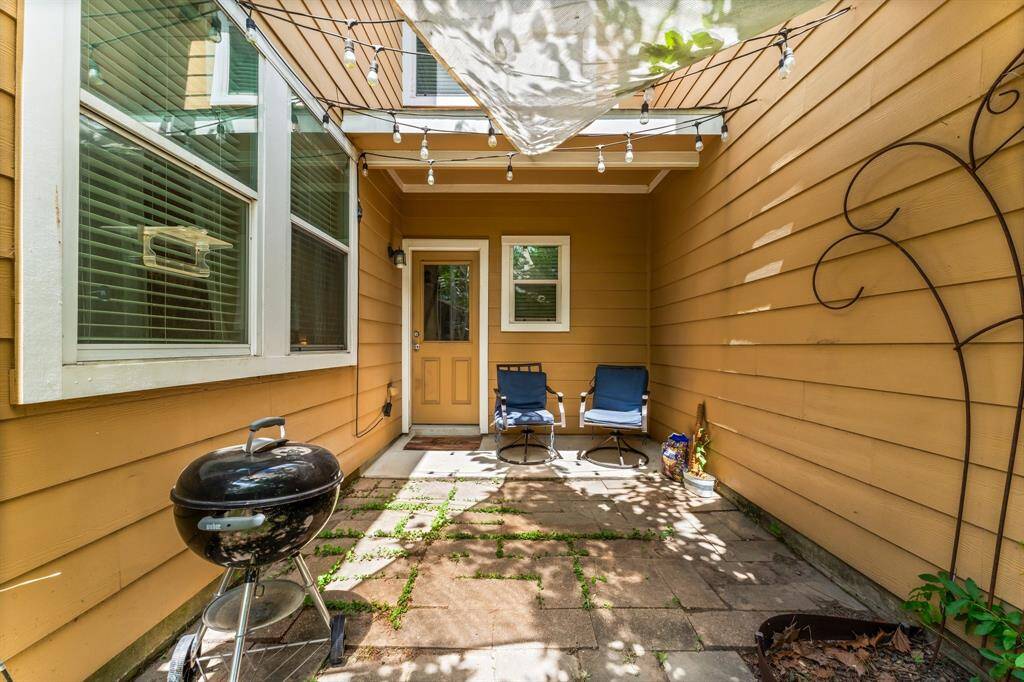 Out back, you have a covered patio area and pavers that extend it out.