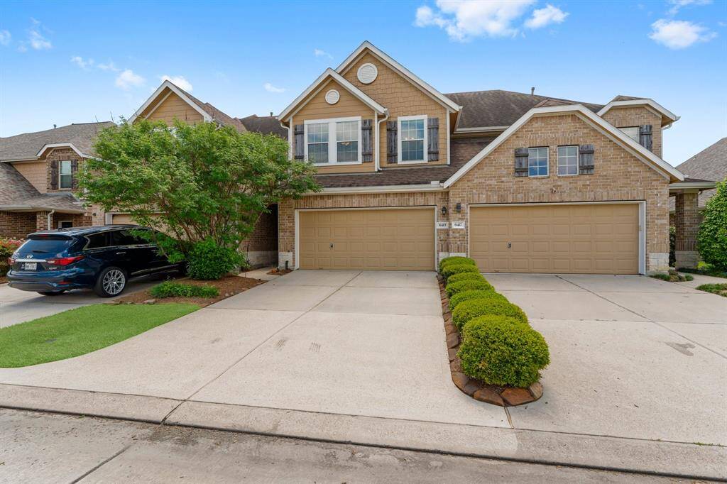 The double wide driveway is separated from the other driveways by landscaping that is taken care of by the HOA.