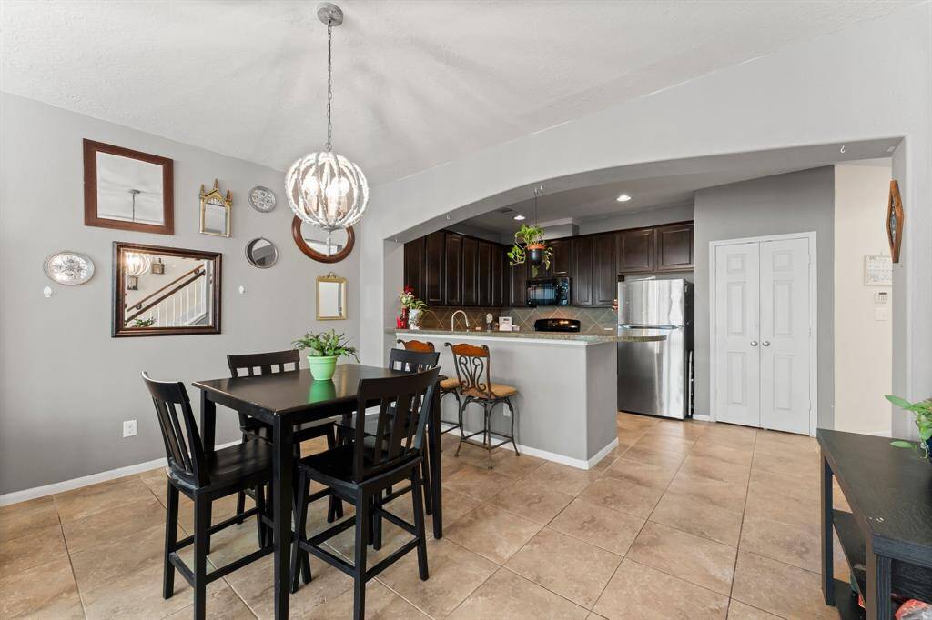 The Breakfast Room has room for a larger table. All tile flooring in this area.