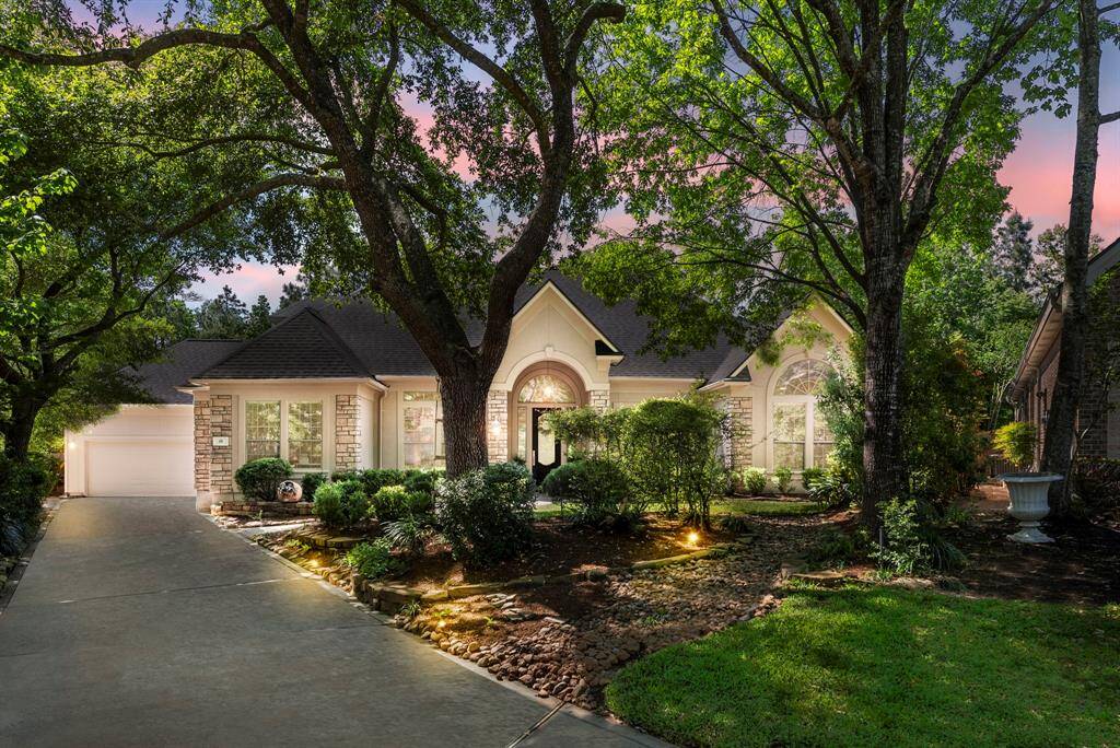 Sought after custom one story nestled in the trees of Sterling Ridge and desirable Southern Garden enclave!