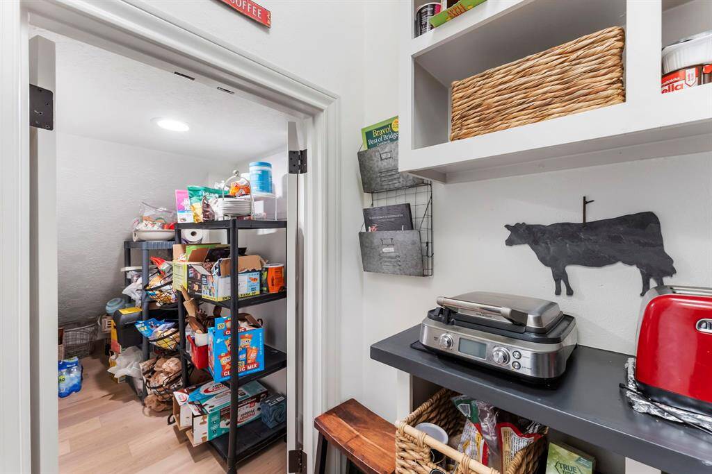 A functional working pantry, complete with additional storage tucked under the stairs.