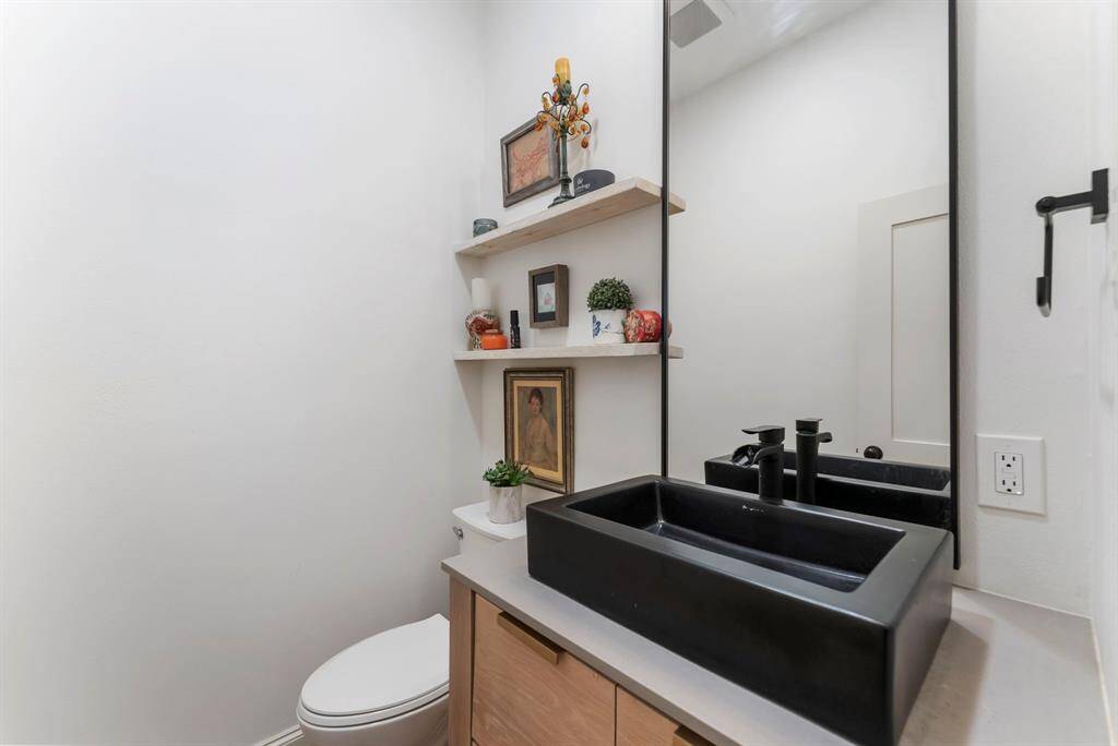 Convenient half bathroom updated in 2021.