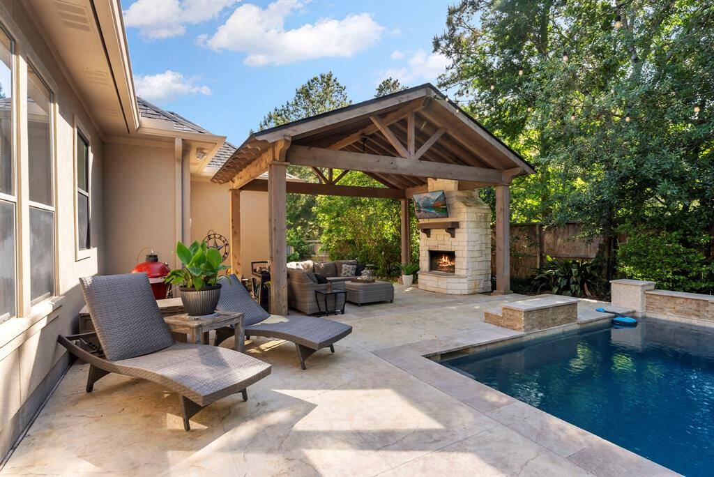 Installed in 2019, the pergola features a beautiful stone fireplace, creating a cozy outdoor retreat for year-round enjoyment.