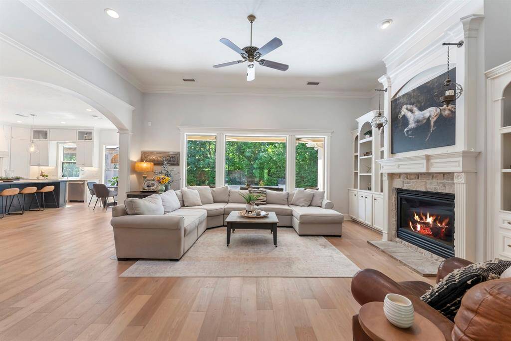Spacious yet inviting, the family room features soaring ceilings, recessed lighting, and a seamless flow into the kitchen—perfect for everyday living and entertaining.