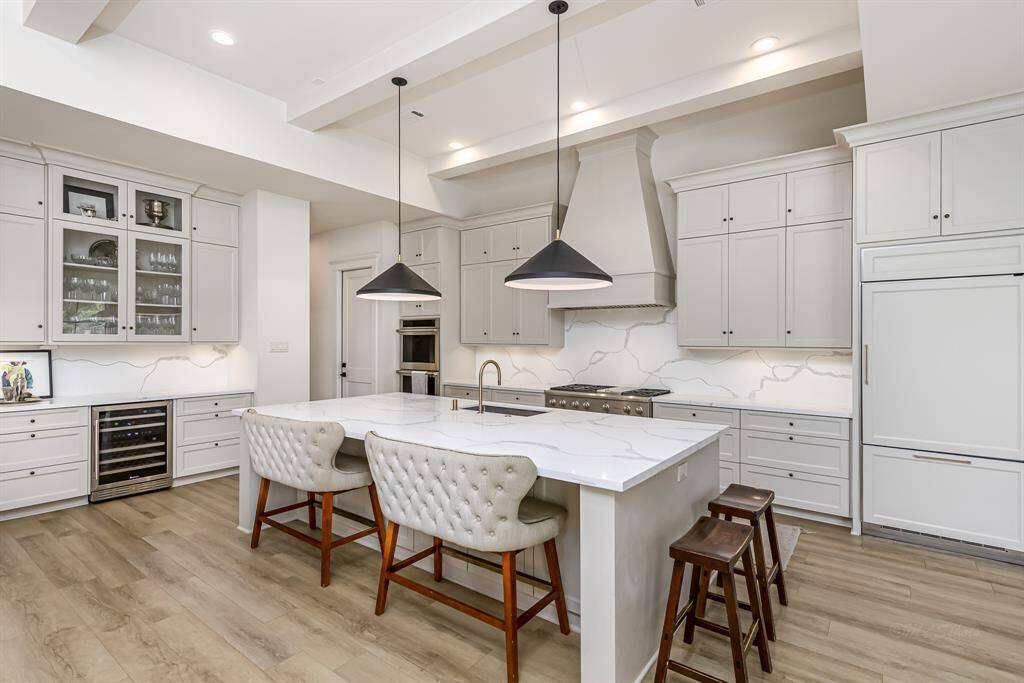Spacious eat in island and butler's pantry with wine fridge.