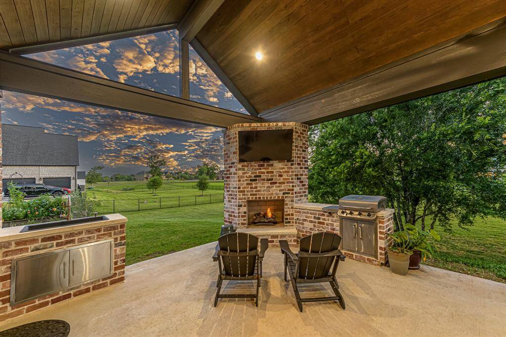 Cozy up on a cool night and enjoy the outdoor fireplace.