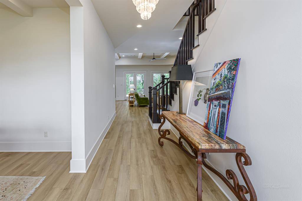 Walk into this beautiful foyer with a sightline to the beautiful backyard and pool.