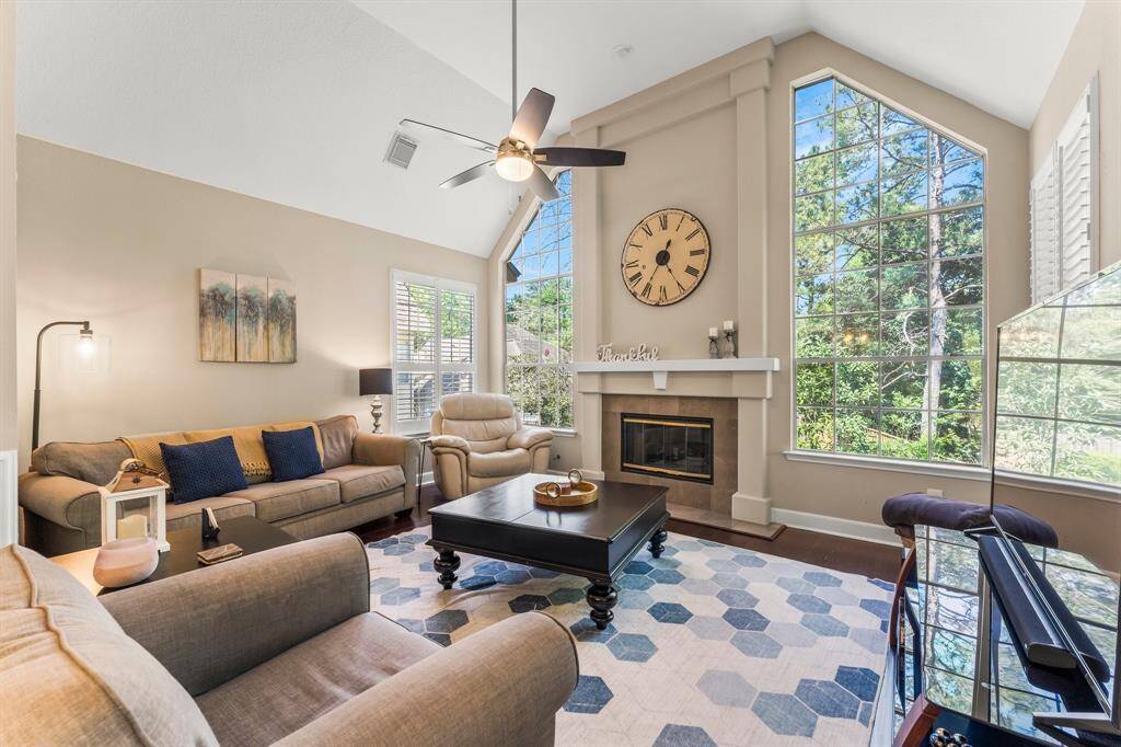 Upstairs living room with vaulted ceilings and large picture windows