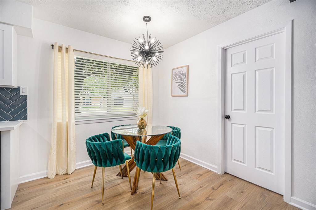 Breakfast area with window and door to laundry