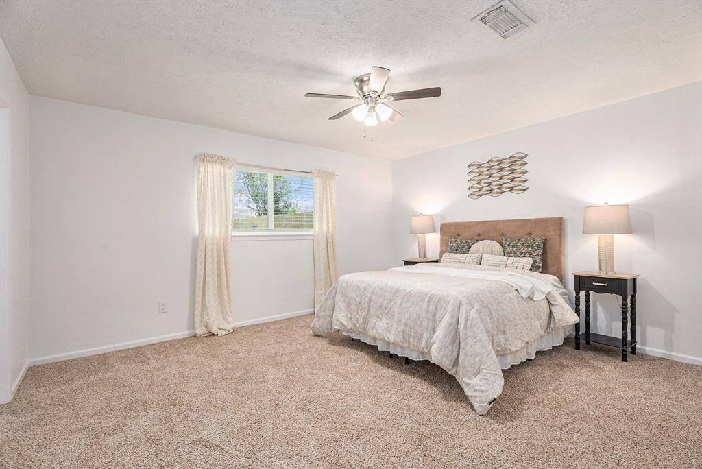 Large primary bedroom easily will accommodate a King bed