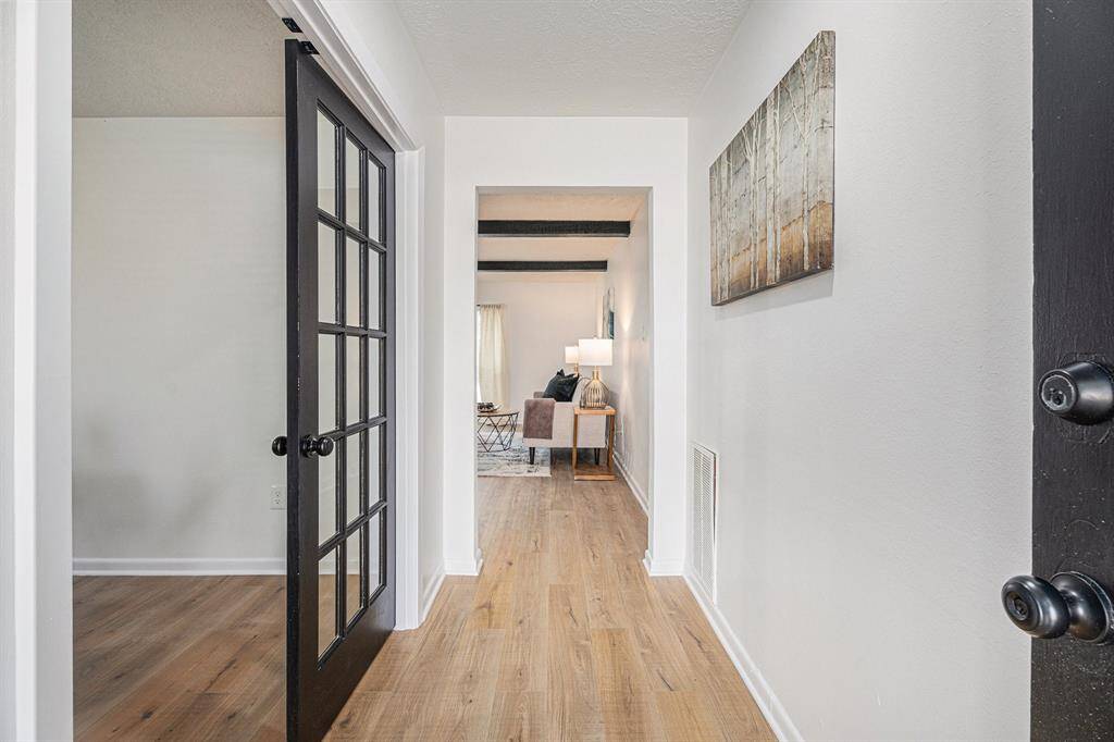 Once you open you are welcomed with a nice foyer and a study/bedroom on the left.