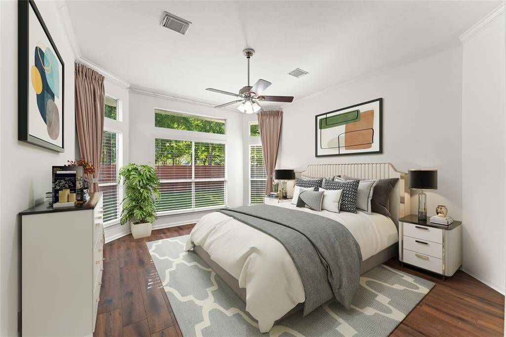 The master bedroom is a peaceful retreat, offering a quiet sanctuary to unwind after a busy day. Large windows invite natural light, creating a bright and airy atmosphere.