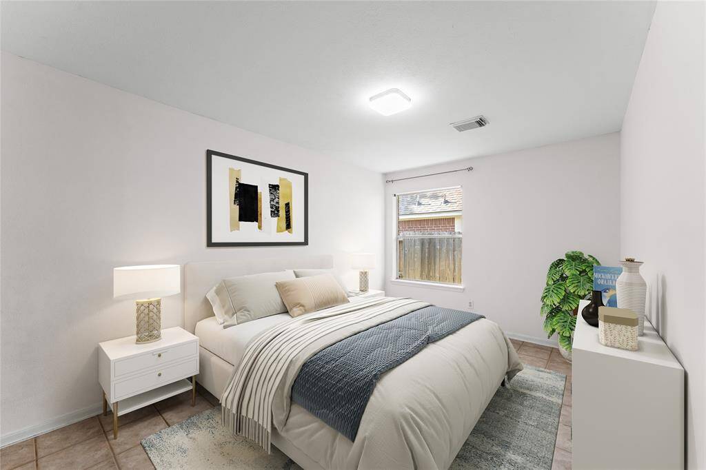 This quiet fourth bedroom is perfect for rest, reading, or work-from-home needs. Neutral tones provide a peaceful backdrop, ready for any personal style.